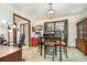 Bright dining area features a classic chandelier, view of outside, and a built-in buffet at 2351 Mandarin Rd, Deland, FL 32720