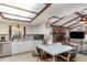 Bright eat-in kitchen features a skylight, stainless steel appliances, and seamless access to the living room at 2351 Mandarin Rd, Deland, FL 32720