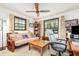 Versatile room with flexible use as an office or living space, featuring natural light and neutral decor at 2351 Mandarin Rd, Deland, FL 32720