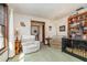 Cozy living room with comfortable seating, bright light, and a large bookshelf at 2351 Mandarin Rd, Deland, FL 32720