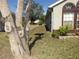 Landscaped side yard with mature trees at 265 Kassik Cir, Orlando, FL 32824