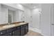 Double vanity bathroom with shower and neutral tile flooring at 2860 Ne 42Nd Rd, Ocala, FL 34470