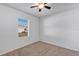 Well-lit bedroom featuring a window with blinds and neutral walls at 2860 Ne 42Nd Rd, Ocala, FL 34470
