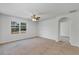 Large bedroom with ceiling fan and access to another room at 2860 Ne 42Nd Rd, Ocala, FL 34470