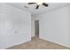 Spacious bedroom with ceiling fan and access to hallway at 2860 Ne 42Nd Rd, Ocala, FL 34470