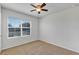 Bright bedroom with neutral walls, ceiling fan, and carpeting at 2860 Ne 42Nd Rd, Ocala, FL 34470