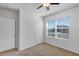 Well-lit bedroom with neutral walls, ceiling fan and window blinds at 2860 Ne 42Nd Rd, Ocala, FL 34470
