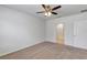 Spacious bedroom with private bath access and ceiling fan at 2860 Ne 42Nd Rd, Ocala, FL 34470