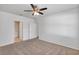 Large bedroom with access to hallway bath and ceiling fan at 2860 Ne 42Nd Rd, Ocala, FL 34470