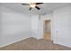 Spacious bedroom with ceiling fan and access to bathroom at 2860 Ne 42Nd Rd, Ocala, FL 34470
