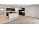 Open kitchen with island, dark cabinetry, and tile flooring at 2860 Ne 42Nd Rd, Ocala, FL 34470