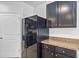 Modern kitchen with dark cabinets and granite counters at 2860 Ne 42Nd Rd, Ocala, FL 34470