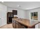 Modern kitchen with island, stainless steel appliances, and dark brown cabinets at 2860 Ne 42Nd Rd, Ocala, FL 34470