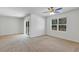 Spacious living area with sliding glass doors and neutral carpeting at 2860 Ne 42Nd Rd, Ocala, FL 34470
