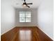 Bright bedroom with hardwood floors and ceiling fan at 333 N Forest Ave, Orlando, FL 32803