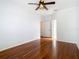 Hardwood floor bedroom with ceiling fan and access to bathroom at 333 N Forest Ave, Orlando, FL 32803