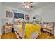 Cozy bedroom with hardwood floors and a full-size bed at 3501 Calumet Dr, Orlando, FL 32810