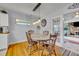 Cozy dining area with a wooden table and chairs, near the kitchen at 3501 Calumet Dr, Orlando, FL 32810