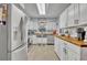 Updated kitchen, featuring stainless steel appliances and butcher block countertops at 3501 Calumet Dr, Orlando, FL 32810