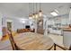 Modern kitchen with white cabinets, butcher block counters and stainless steel appliances at 3501 Calumet Dr, Orlando, FL 32810