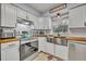 Bright kitchen with white cabinets, stainless steel appliances and wood countertops at 3501 Calumet Dr, Orlando, FL 32810