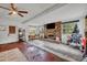 Spacious living area with brick fireplace and large windows at 3501 Calumet Dr, Orlando, FL 32810