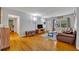 Spacious living room with hardwood floors and access to other rooms at 3501 Calumet Dr, Orlando, FL 32810