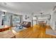 Open living room with hardwood floors and a view of the kitchen at 3501 Calumet Dr, Orlando, FL 32810