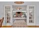 View of living room with fireplace and French doors at 3501 Calumet Dr, Orlando, FL 32810