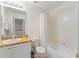 Bathroom with a shower and tub combination and a single sink vanity with marble countertops at 3632 Calabria Ave, Davenport, FL 33897