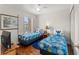 Charming bedroom with twin beds, playful decor, and a tropical theme at 3632 Calabria Ave, Davenport, FL 33897