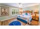 Inviting bedroom with hardwood floors, natural light, ceiling fan, and a charming, bright, tropical motif at 3632 Calabria Ave, Davenport, FL 33897