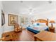 Comfortable main bedroom with bamboo furnishings, wood floors, and plantation shutters at 3632 Calabria Ave, Davenport, FL 33897