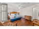Serene main bedroom with bamboo accents, plantation shutters, and hardwood flooring at 3632 Calabria Ave, Davenport, FL 33897