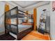 Bedroom with a bunk bed, full-size mattress, and an orange area rug at 415 N Shine Ave, Orlando, FL 32803