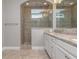 Elegant bathroom with a large walk-in shower and granite countertops at 530 Windy Pine Way, Oviedo, FL 32765