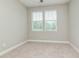 Spacious bedroom featuring two windows with blinds and ceiling fan at 530 Windy Pine Way, Oviedo, FL 32765