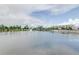 Peaceful lake view with fountain and community building at 530 Windy Pine Way, Oviedo, FL 32765