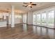 Large living room with hardwood floors, access to backyard, and open floor plan at 530 Windy Pine Way, Oviedo, FL 32765