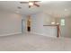 Spacious loft area with carpeted floor and ceiling fan at 530 Windy Pine Way, Oviedo, FL 32765