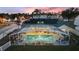 Aerial view of house with solar panels and large, screened pool at 5504 Hamlin Close Rd, Davenport, FL 33896