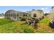 Large backyard with pool, patio, and fire pit at 5504 Hamlin Close Rd, Davenport, FL 33896