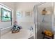 Clean bathroom with soaking tub, shower, and stained glass window at 5504 Hamlin Close Rd, Davenport, FL 33896