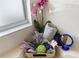 Bathroom detail showing towels, orchids, and bath accessories at 5504 Hamlin Close Rd, Davenport, FL 33896