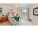 Cozy bedroom with a queen-size bed and ample natural light at 5504 Hamlin Close Rd, Davenport, FL 33896