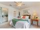 Bedroom with double bed, en-suite bathroom access, and decorative wall art at 5504 Hamlin Close Rd, Davenport, FL 33896