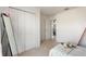 Bedroom with a twin bed, built-in closet, and full-length mirror at 5504 Hamlin Close Rd, Davenport, FL 33896