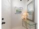 Bright entryway with a glass-top console table and mirror at 5504 Hamlin Close Rd, Davenport, FL 33896
