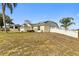 Charming single-story home with solar panels and lush lawn at 5504 Hamlin Close Rd, Davenport, FL 33896