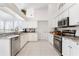 Modern kitchen with stainless steel appliances and granite countertops at 5504 Hamlin Close Rd, Davenport, FL 33896